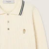 Men’s long-sleeved polo shirt in white knit with contrasting edges and removable pin