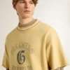 Men's oversized yellow cotton T-shirt with blue print
