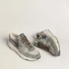 Men's Running Sole in light blue nylon with black star and green leather heel tab