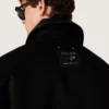 Men's short padded jacket in black cotton with leather collar