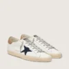 Men's Super-Star in white leather with midnight-blue canvas star and tobacco leather heel tab