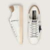 Men's Super-Star in white leather with midnight-blue canvas star and tobacco leather heel tab