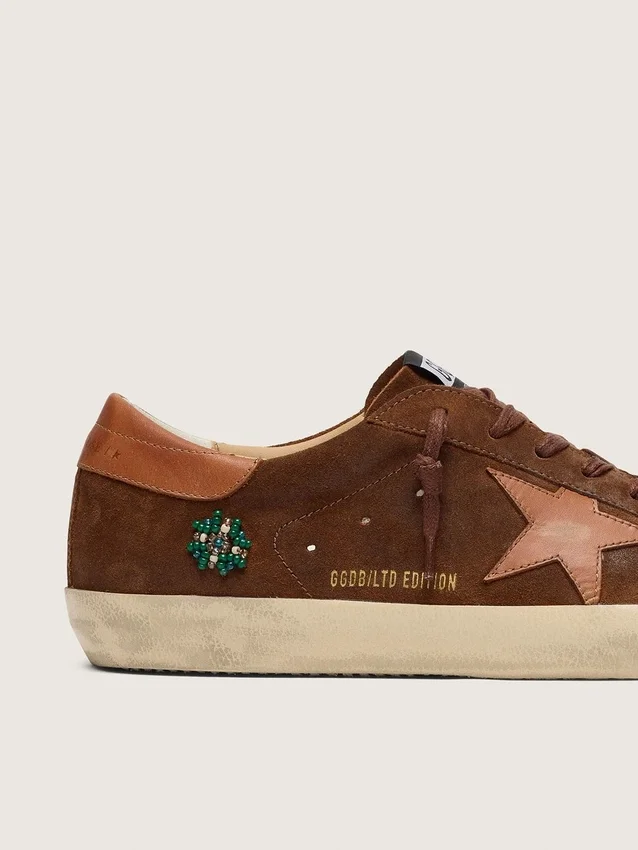 Men’s Super-Star LTD in brown suede with brick-red leather star and embroidery with green beads