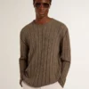 Men's travertine-colored sweater with 'Golden' patch lettering on the back