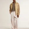 Men's travertine-colored sweater with 'Golden' patch lettering on the back