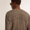 Men's travertine-colored sweater with 'Golden' patch lettering on the back