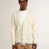 Men's white cotton cardigan with a cable pattern and blue ribbing