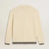 Men's white cotton cardigan with a cable pattern and blue ribbing