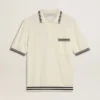 Men's worn-white knitted polo shirt with blue ribbing