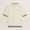 Men's worn-white knitted polo shirt with blue ribbing
