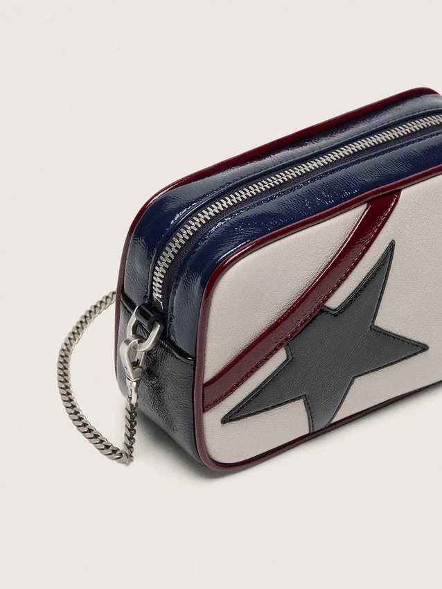 Mini Star Bag in butter-white leather with black star and burgundy and dark blue details