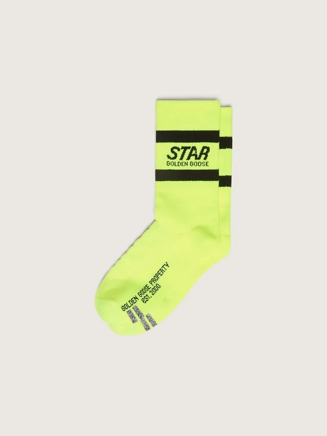 Neon yellow sports socks with black stripes