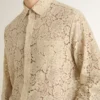 Oversized shirt in cream-colored see-through lace