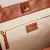 Pasadena Bag in tan-colored glossy hammered leather with gold logo on the front