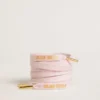 Pink cotton laces with contrasting gold-colored logo