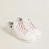 Pink cotton laces with contrasting gold-colored logo