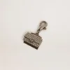 Purse-shaped charm in silver-colored brass with crystals