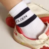 Ribbed socks with navy-blue stripes and logo