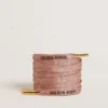 Salmon pink Lurex laces with contrasting black logo