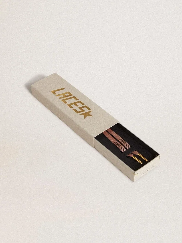 Salmon pink Lurex laces with contrasting black logo