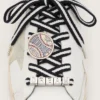 Skins cream and dark blue striped laces with pin and silver appliqué