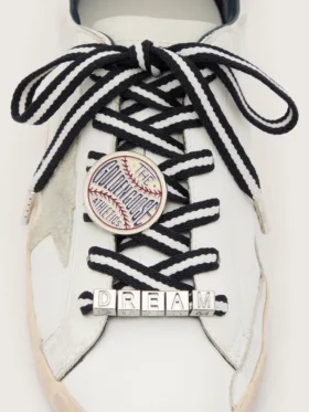 Skins cream and dark blue striped laces with pin and silver appliqué