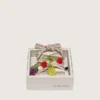 Skins cream and dove-gray striped embroidered laces with three fruit beaded charms