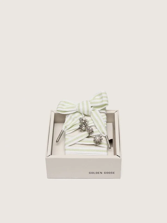 Skins green and white striped laces with jewel charms