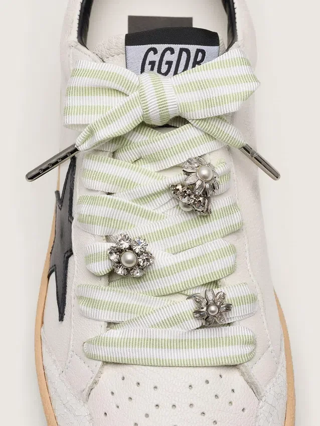 Skins green and white striped laces with jewel charms