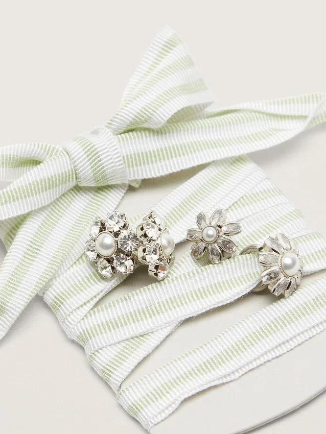 Skins green and white striped laces with jewel charms