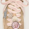 Skins light beige laces with pink braiding, pin and appliqués