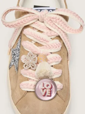 Skins light beige laces with pink braiding, pin and appliqués