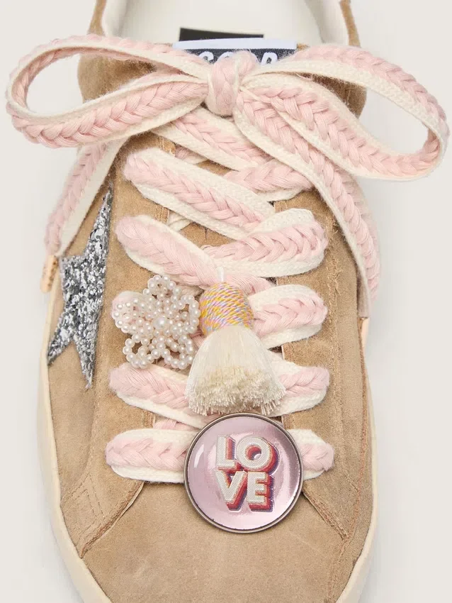 Skins light beige laces with pink braiding, pin and appliqués