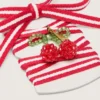 Skins red and white laces with cherry charm