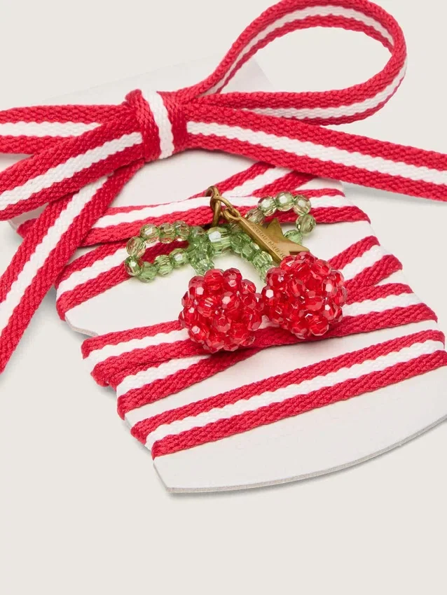 Skins red and white laces with cherry charm