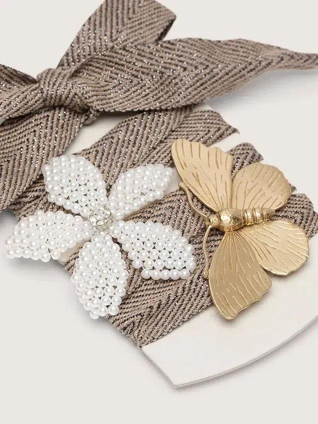 Skins "Sparkling" brown, black and silver herringbone laces with two appliqué charms