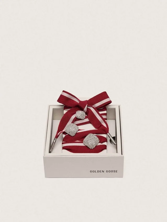 Skins two-tone laces with three silver charms