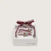 Skins white and burgundy striped laces embellished with charms