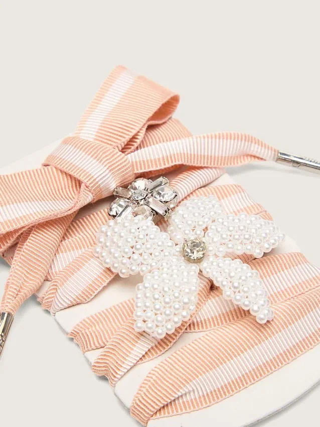 Skins white and pink striped laces with beaded and crystal charms