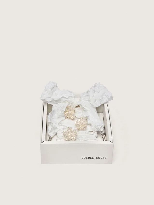 Skins white crinkle laces with flower-shaped beaded appliqués