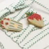 Skins white laces with forest-green embroidery and strawberry pins