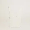 Sleeveless top embroidered with worn-white ribbing