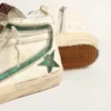 Slide in beige nappa with green laminated leather star and flash