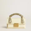 Small Venezia Bag in butter-colored boarded leather with braided scarf