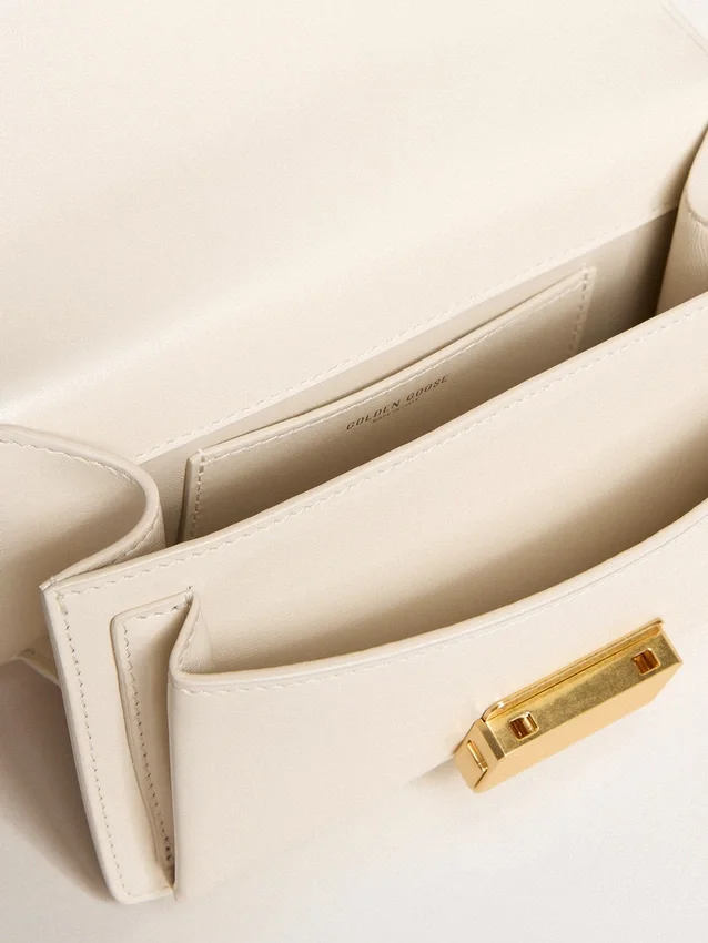 Small Venezia Bag in butter-colored boarded leather with braided scarf