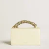 Small Venezia Bag in butter-colored boarded leather with braided scarf and double charm