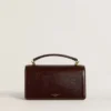 Small Venezia Bag in dark brown laminated leather with gold details