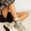 Socks in aged white with two-tone stripes