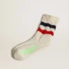 Socks in distressed-finish white cotton with red and navy stripes
