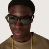 Square style Panthos sunglasses with havana brown frame and green lenses